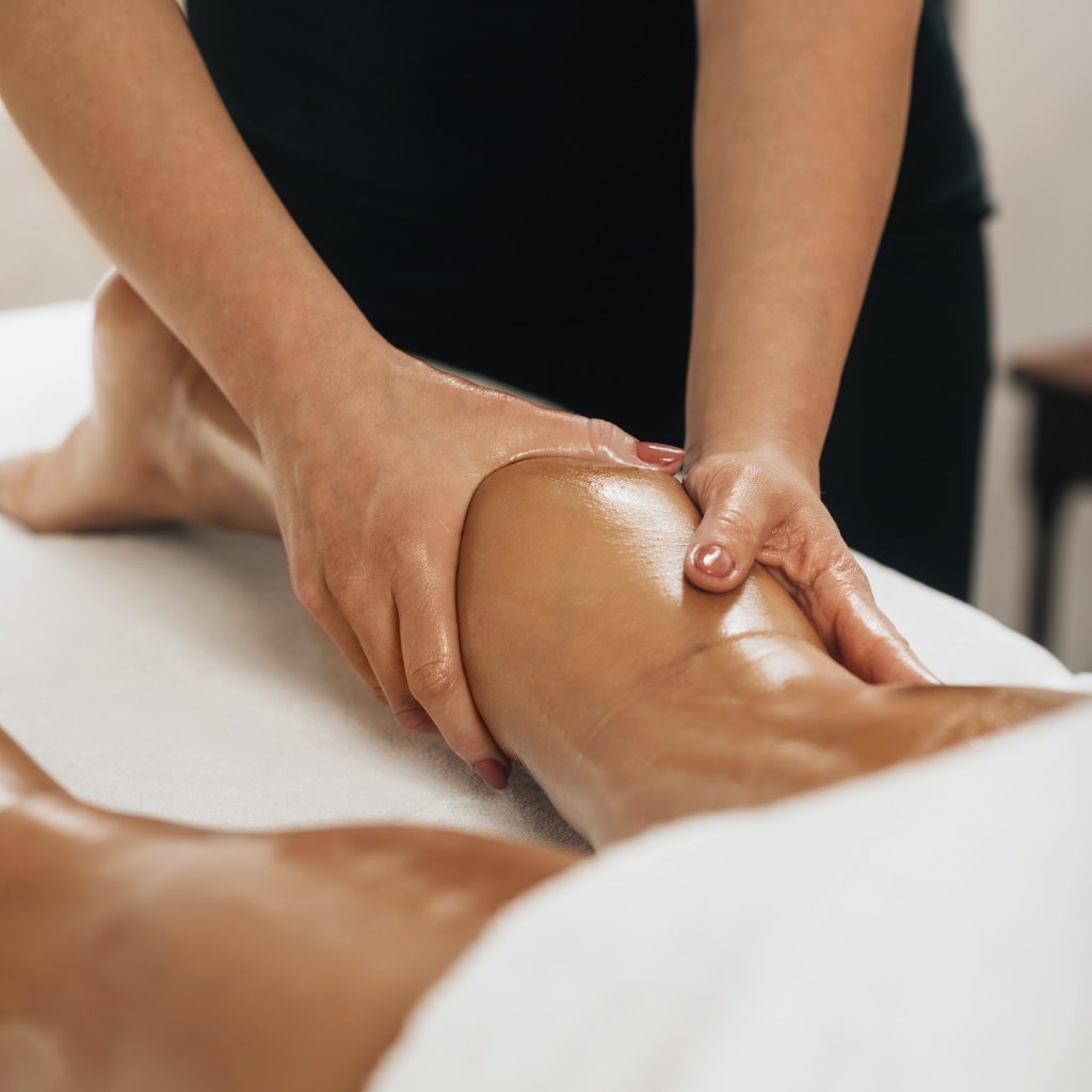 Anti Cellulite Massage. Masseuse Massaging a Female Calf